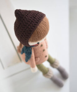 Crochet doll in a coat and bonnet